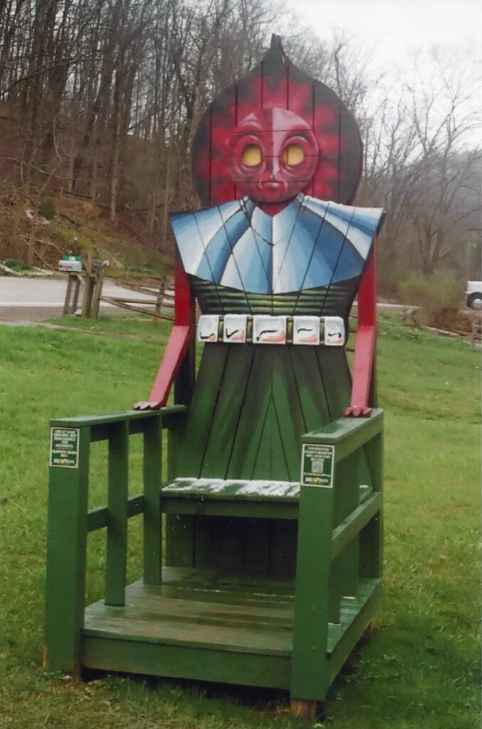 The Flatwoods monster chair welcomes visitors near the Flatwoods town hall